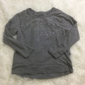 Gray sweater with metal appliqués